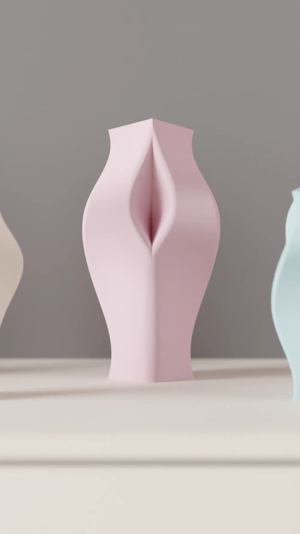 Pastel sculptural vases grouped on a white sideboard