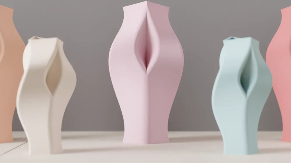 Pastel sculptural vases in pink, cream and blue with twisted geometric forms