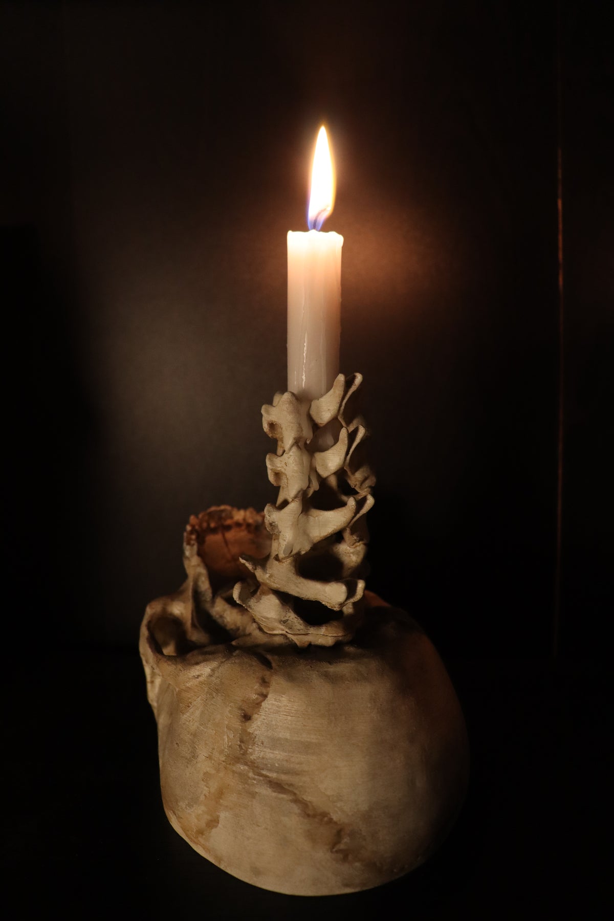 Spine Candle Holder bone white tealight full stack view dramatic candlelight glow