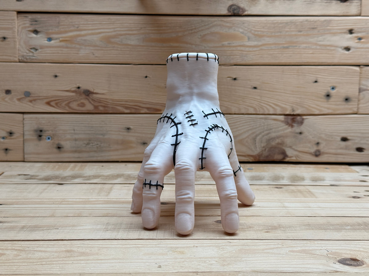 Thing Hand Model — front view standing on fingertips showing palm-side stitching and finger detail