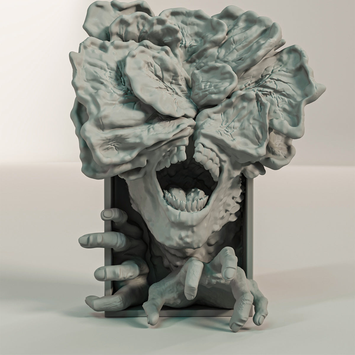 Stranger Things Demogorgon book nook relief sculpture grey matte rectangular framed box massive multi-petalled flower head splitting open deeply folded fleshy lobes wide gaping screaming mouth individual teeth both hands reaching and grasping beyond left and right frame edges front facing view neutral background hero product shot