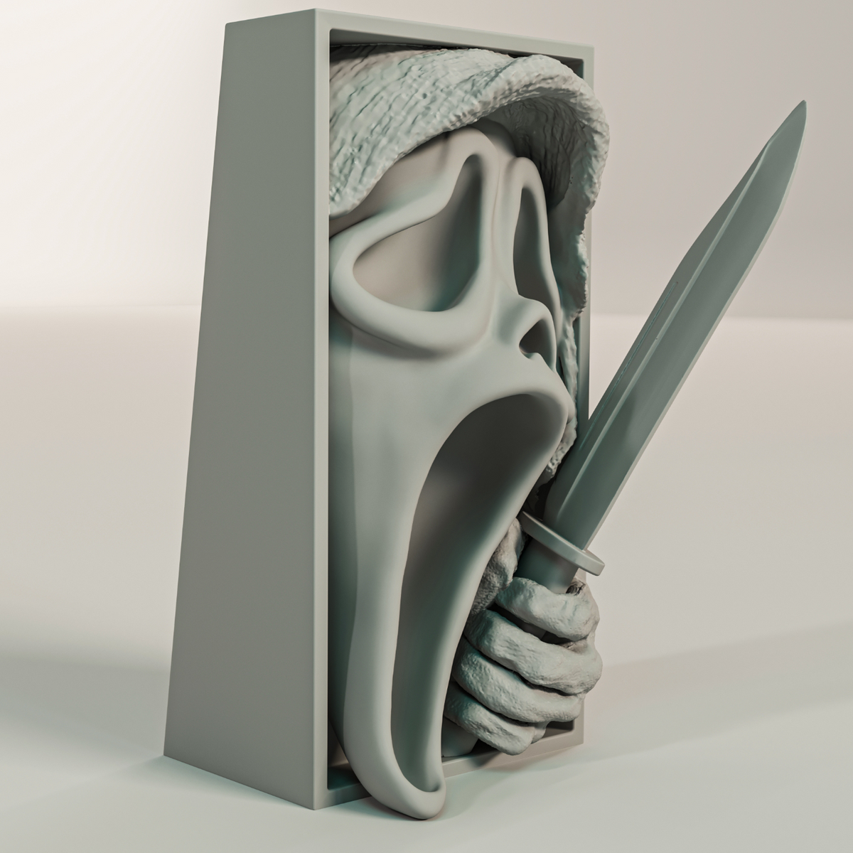 Scream book nook relief sculpture grey rectangular framed box Ghostface mask flowing hooded robe screaming hollow mouth clawed hand clutching knife blade three quarter side angle view showing full depth and height of rectangular box frame neutral background
