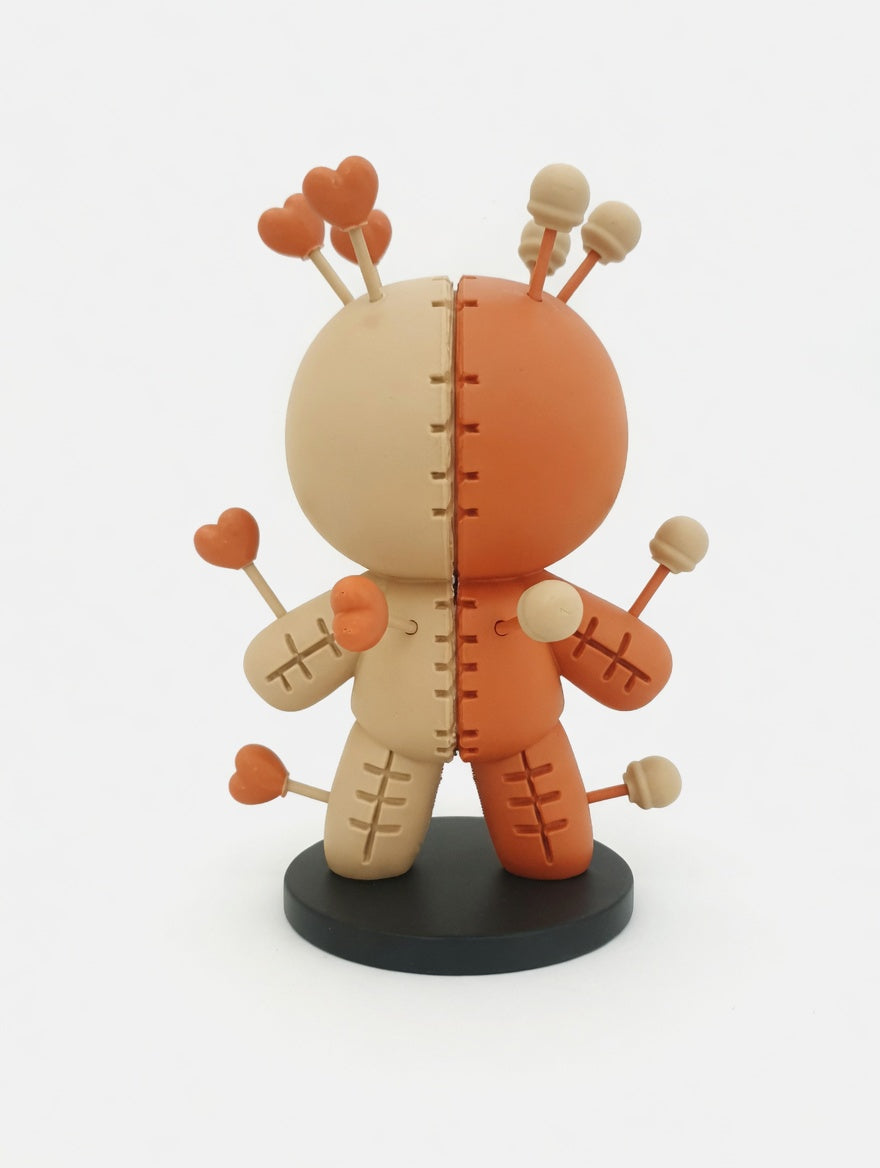 Voodoo Pin Cushion Doll Figure — Skull & Hearts edition front view showing skull pin toppers on terracotta half and heart pin toppers on beige half on black circular display stand