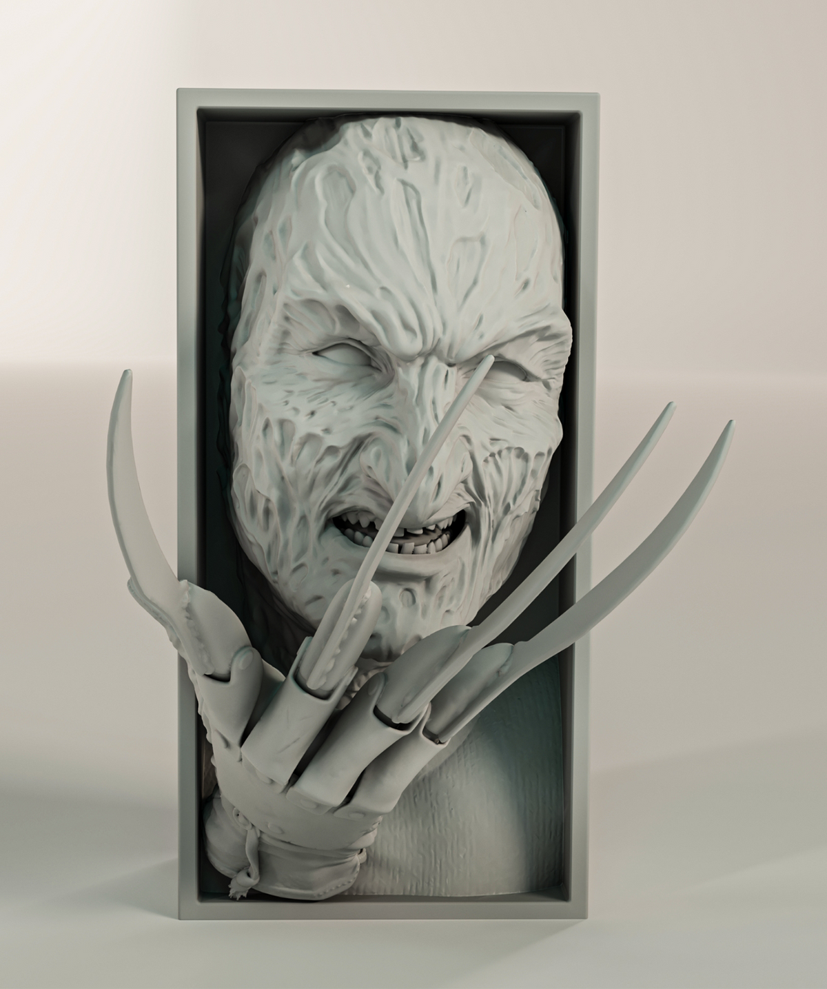 Freddy Krueger book nook relief sculpture grey matte rectangular framed box deeply scarred melted flesh face snarling bared teeth heavy lidded menacing eyes razor claw glove four long curved blades extending beyond frame front facing view neutral background hero product shot