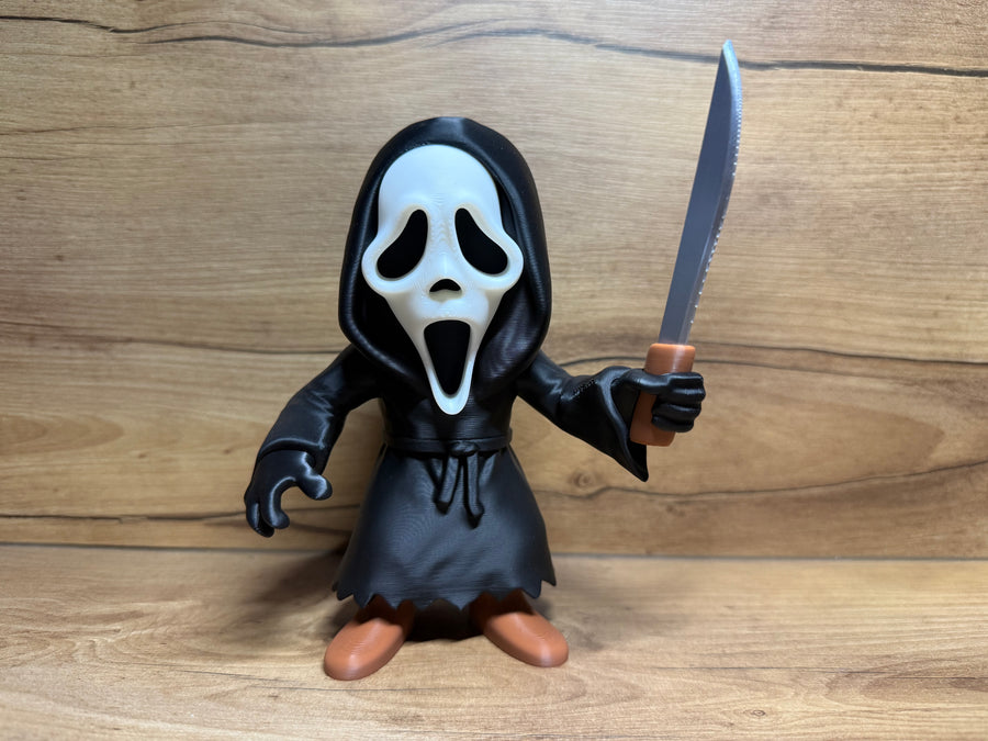 Ghostface Scream Horror Minifigure Sculpture — front view classic screaming mask variant: white elongated ghost mask with two large black teardrop eye apertures deeply recessed, wide open screaming mouth aperture, drooping lower mask point, deep black hooded robe with hood dome, waist cord tie, right hand raised holding large silver serrated hunting knife with brown handle, left hand at side with claw tension, zigzag robe hem