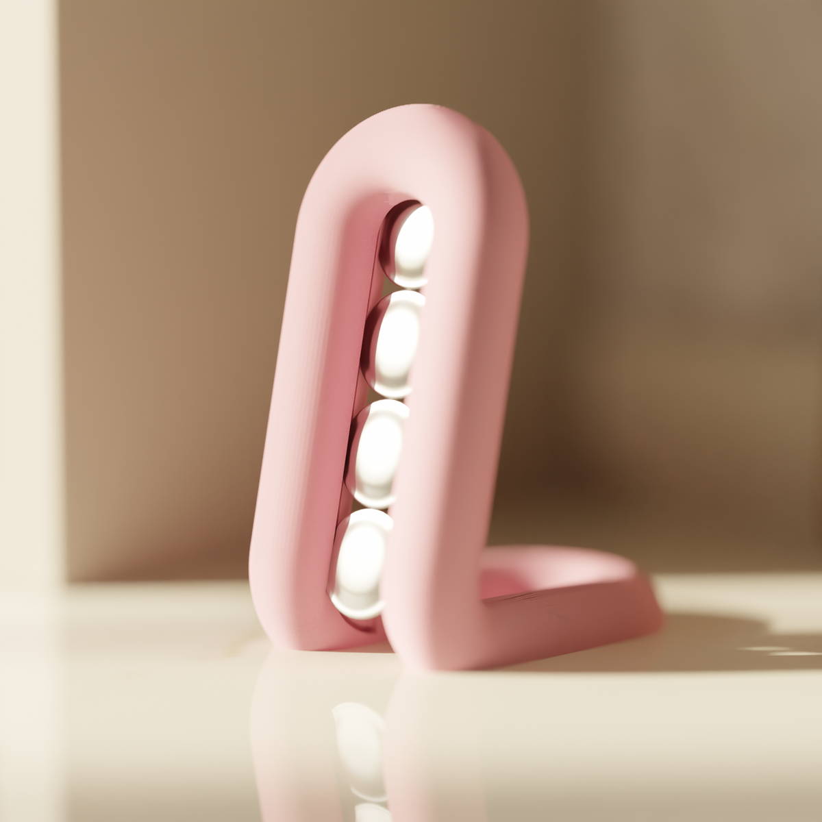 Matte black wibble loop coffee pod holder on white background product shot