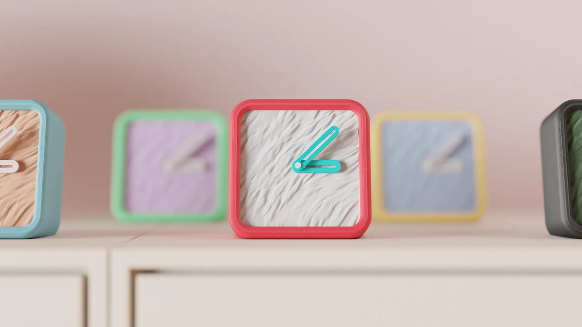 Modern Minimalist Textured Desk Clock five colour variants Purple Green Red Yellow Black on white sideboard lifestyle group shot
