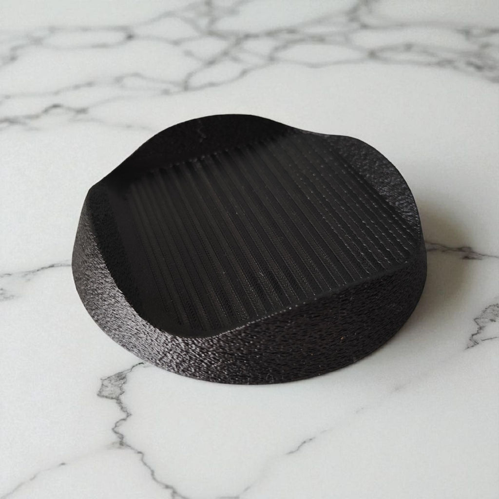 Tilted snack bowl with charm