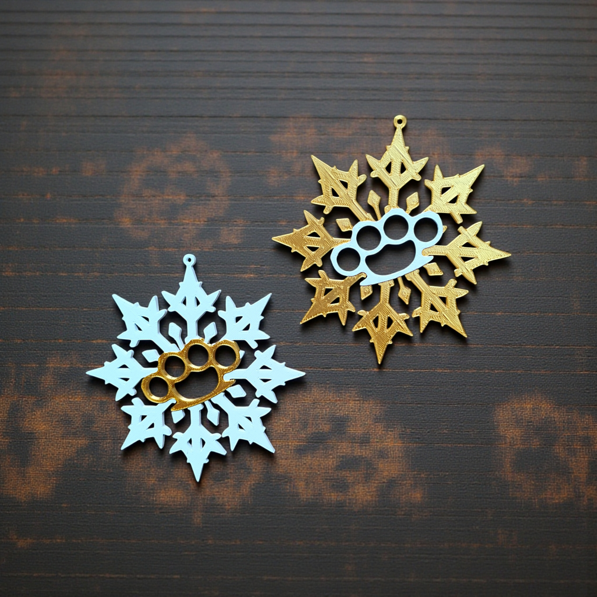 Close-up single gold Bad Snowflake ornament on wood