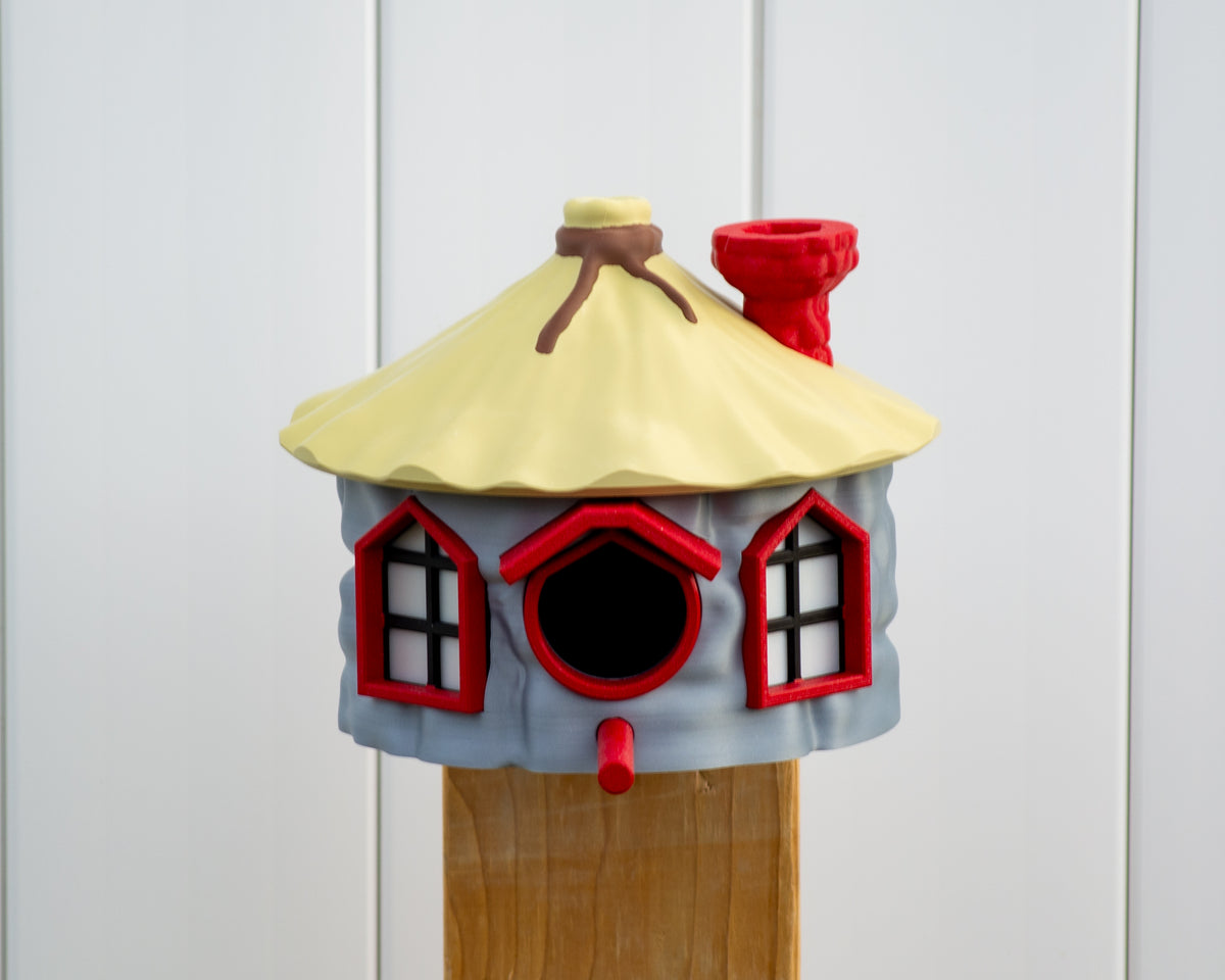 Front view of colourful cottage birdhouse