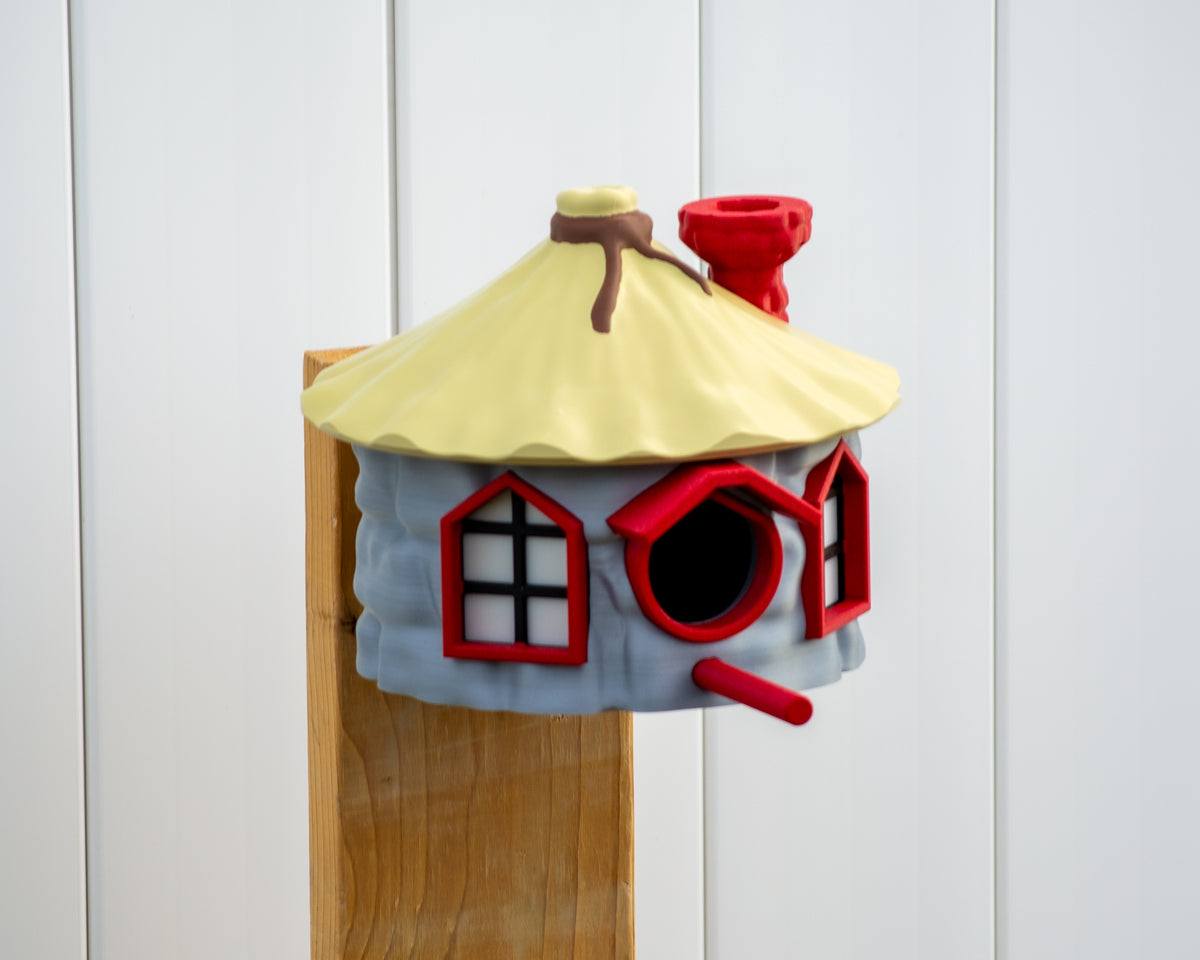 Opposite side of birdhouse showing red window and perch