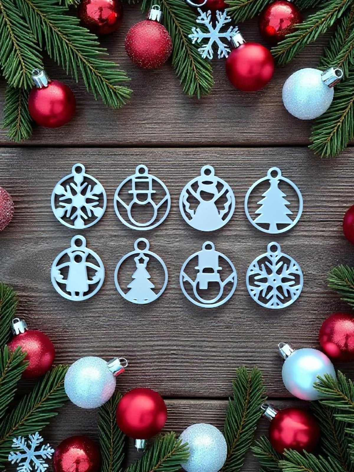 White Christmas tree ornament and snowflake ornament on wooden table beside fireplace