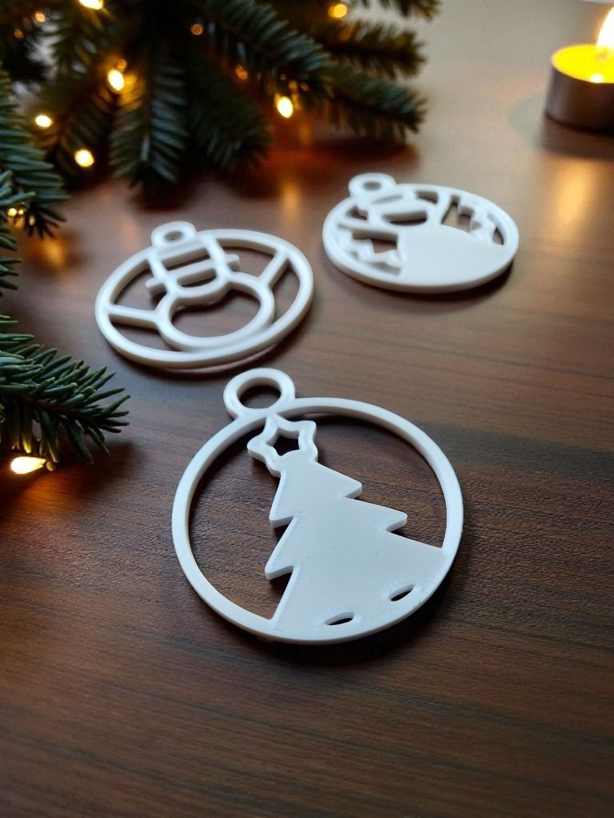 Gold robot and grey snowman minimalist Christmas ornaments on wooden plank background
