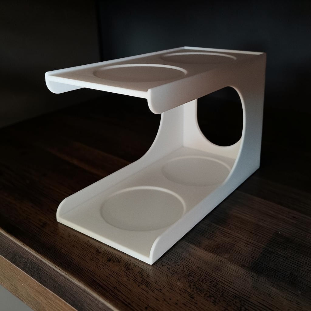Cupstack vertical cup organizer white two-tier product shot on dark shelf