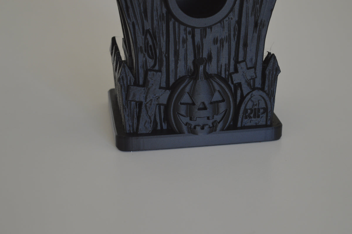 Front of haunted bird house showing entry and base