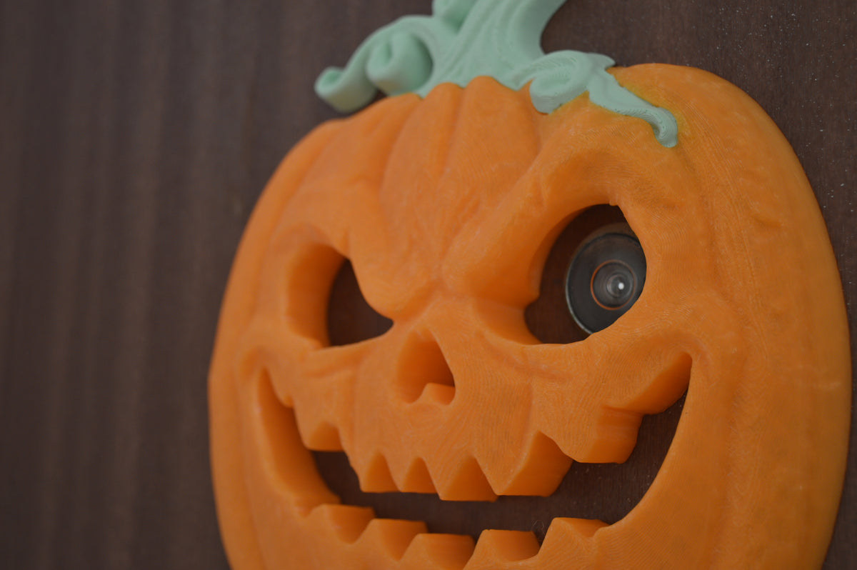 Full door view of pumpkin peep-hole decoration