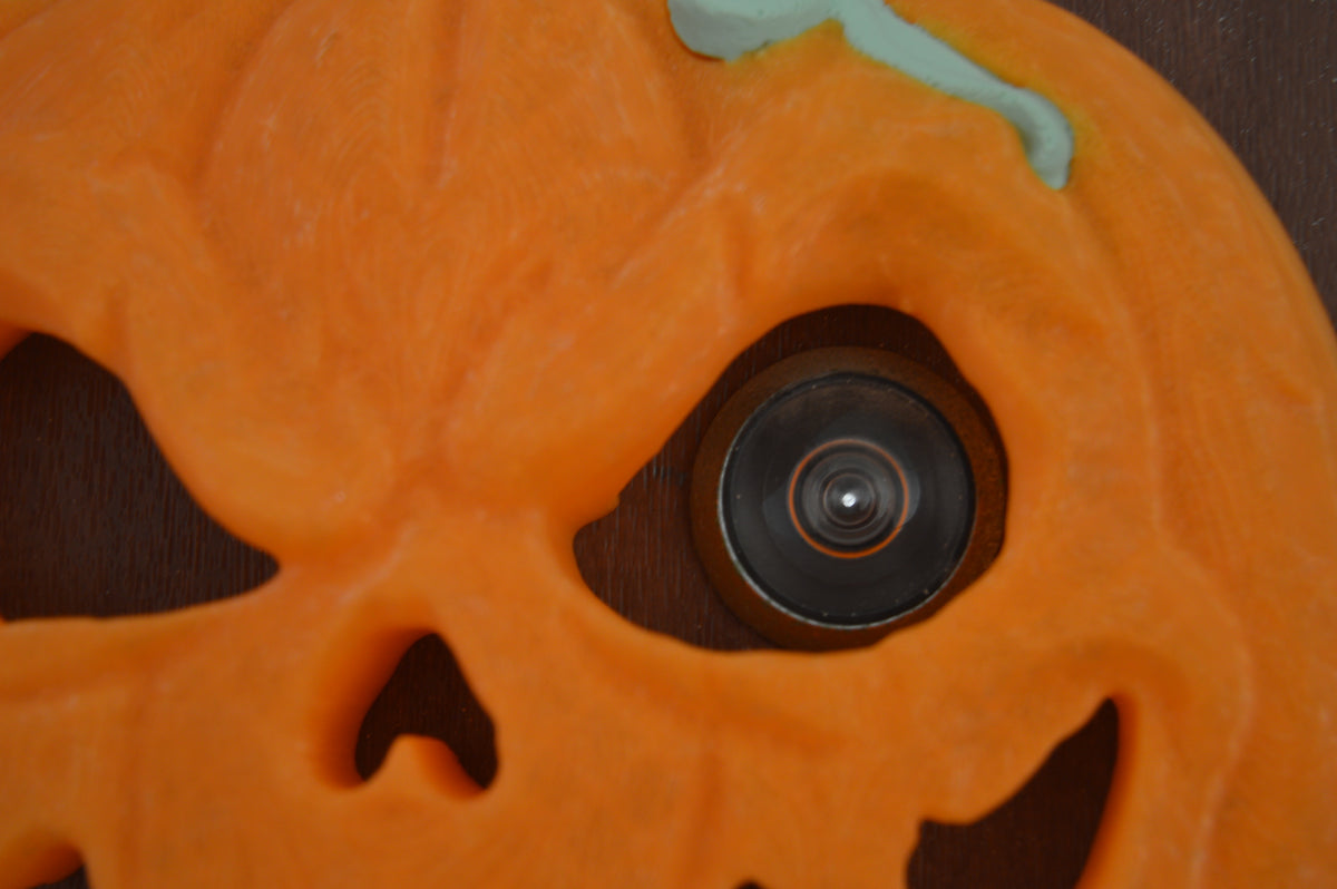 Angled close-up of pumpkin peep-hole decoration