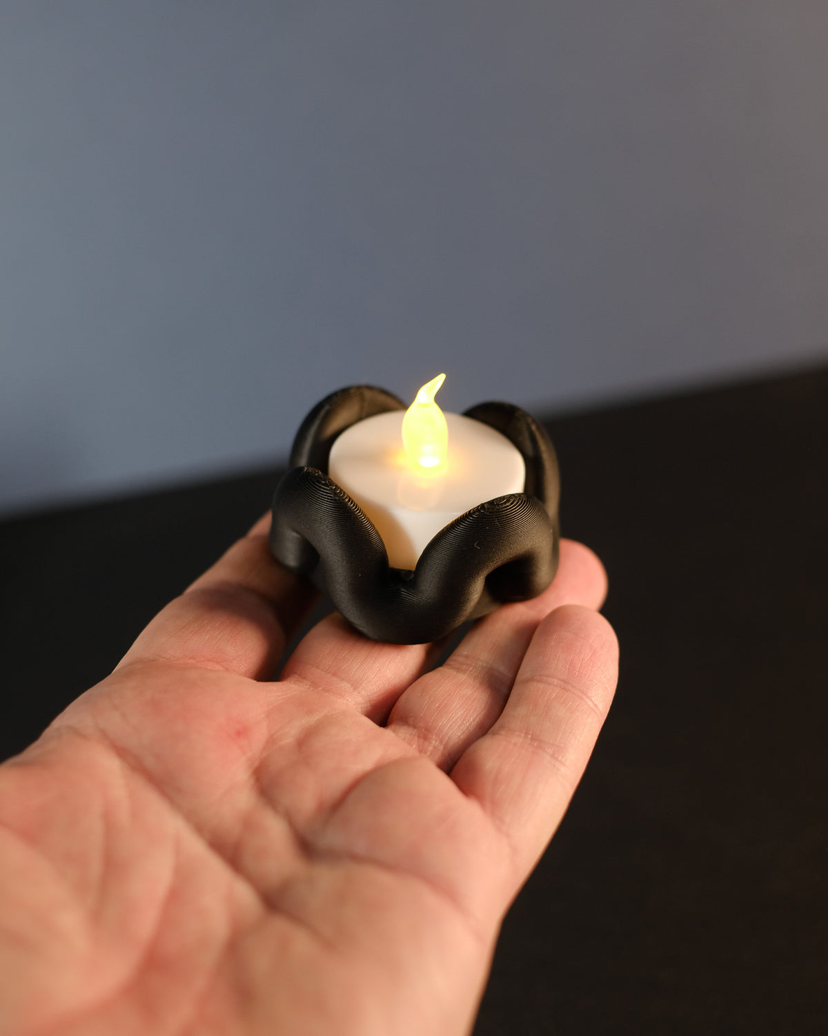 Wibble Tealight Holder - multiple pastel versions held in cupped hands