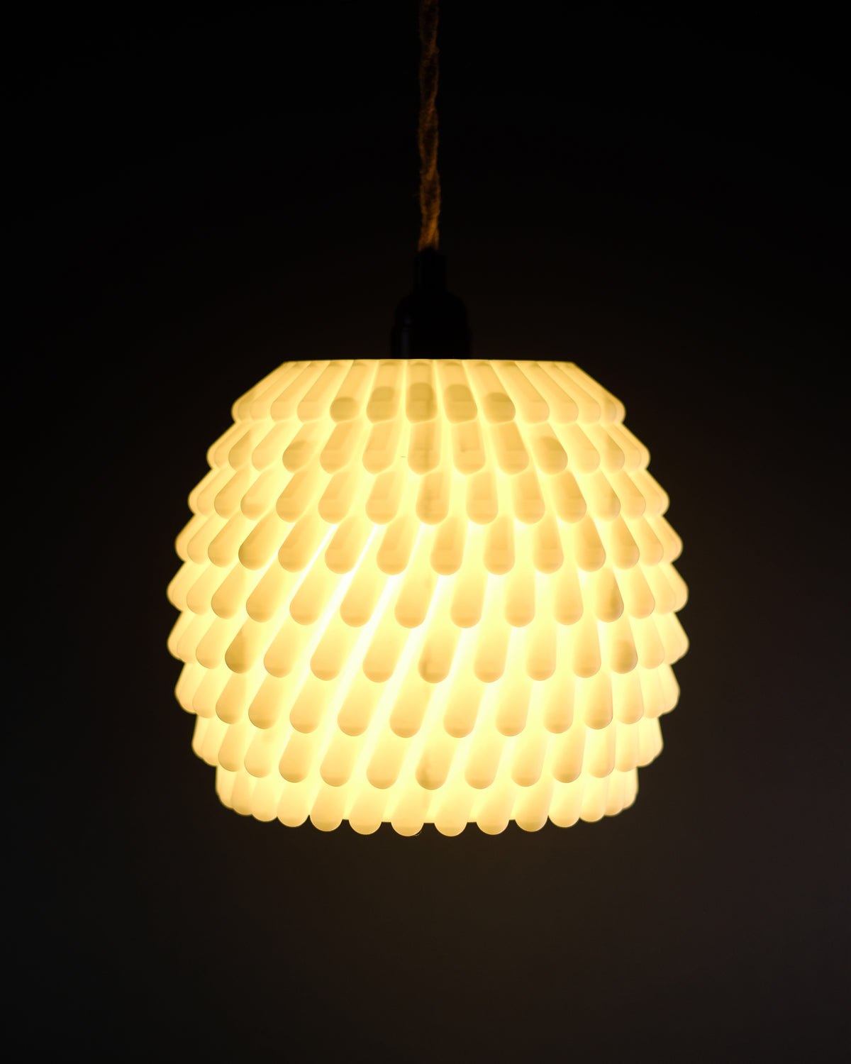 Sea anemone lampshade close up detail of teardrop textured surface on dark background