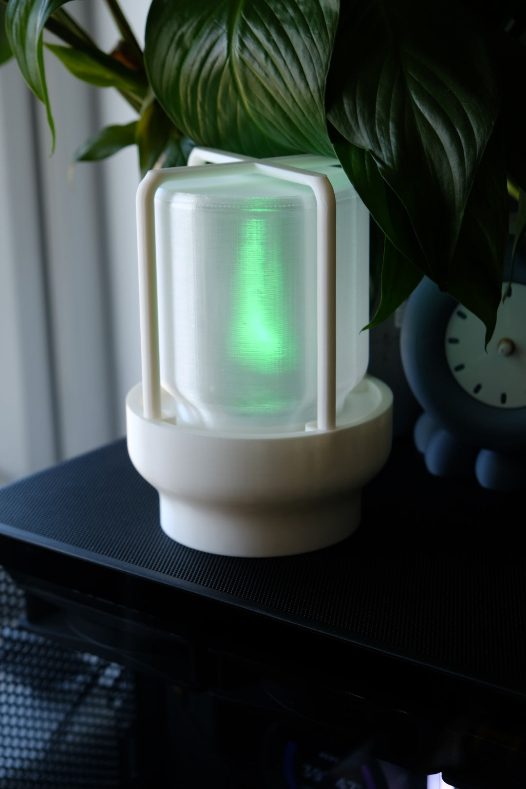 The Miner's Lantern Lamp real photo white on shelf with houseplants warm amber inner glow cosy interior lifestyle