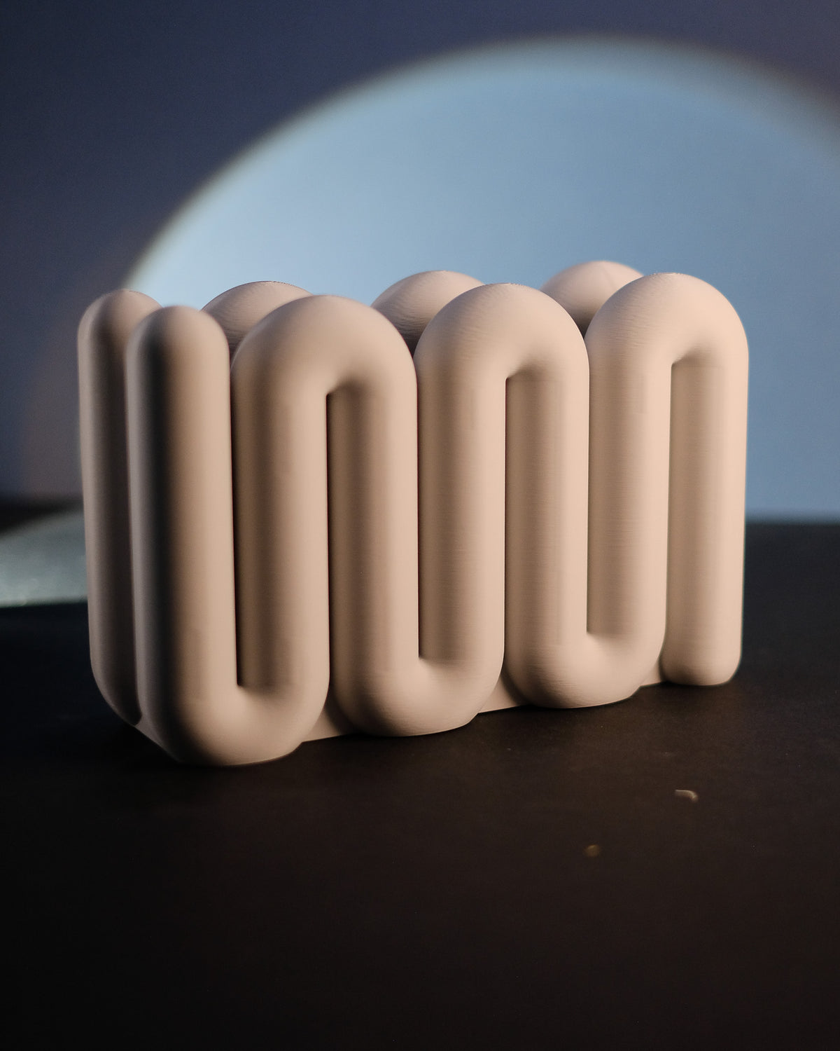 Wibble Vertical Laptop Stand - real photo side view beige on dark surface