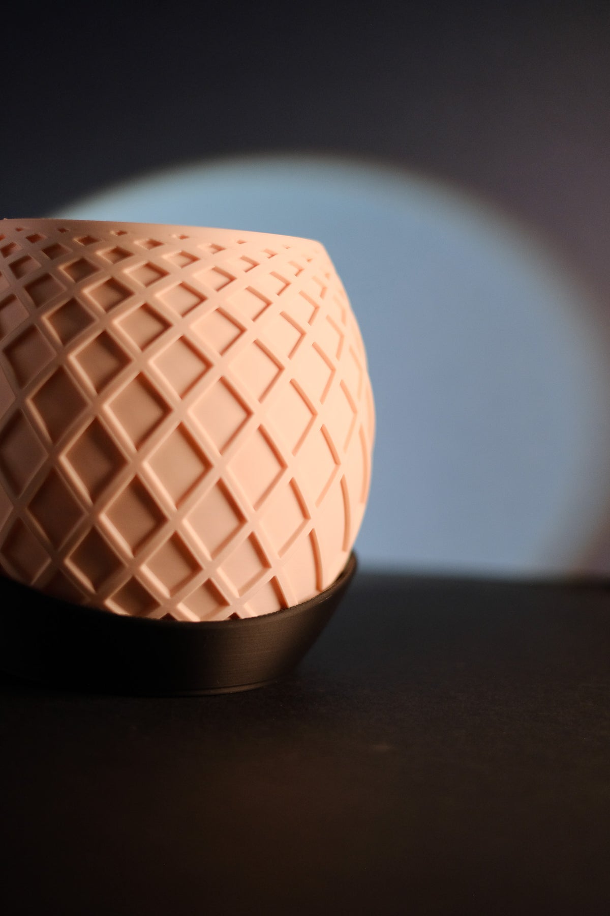 Lattice Globe Planter lit from inside with drip tray