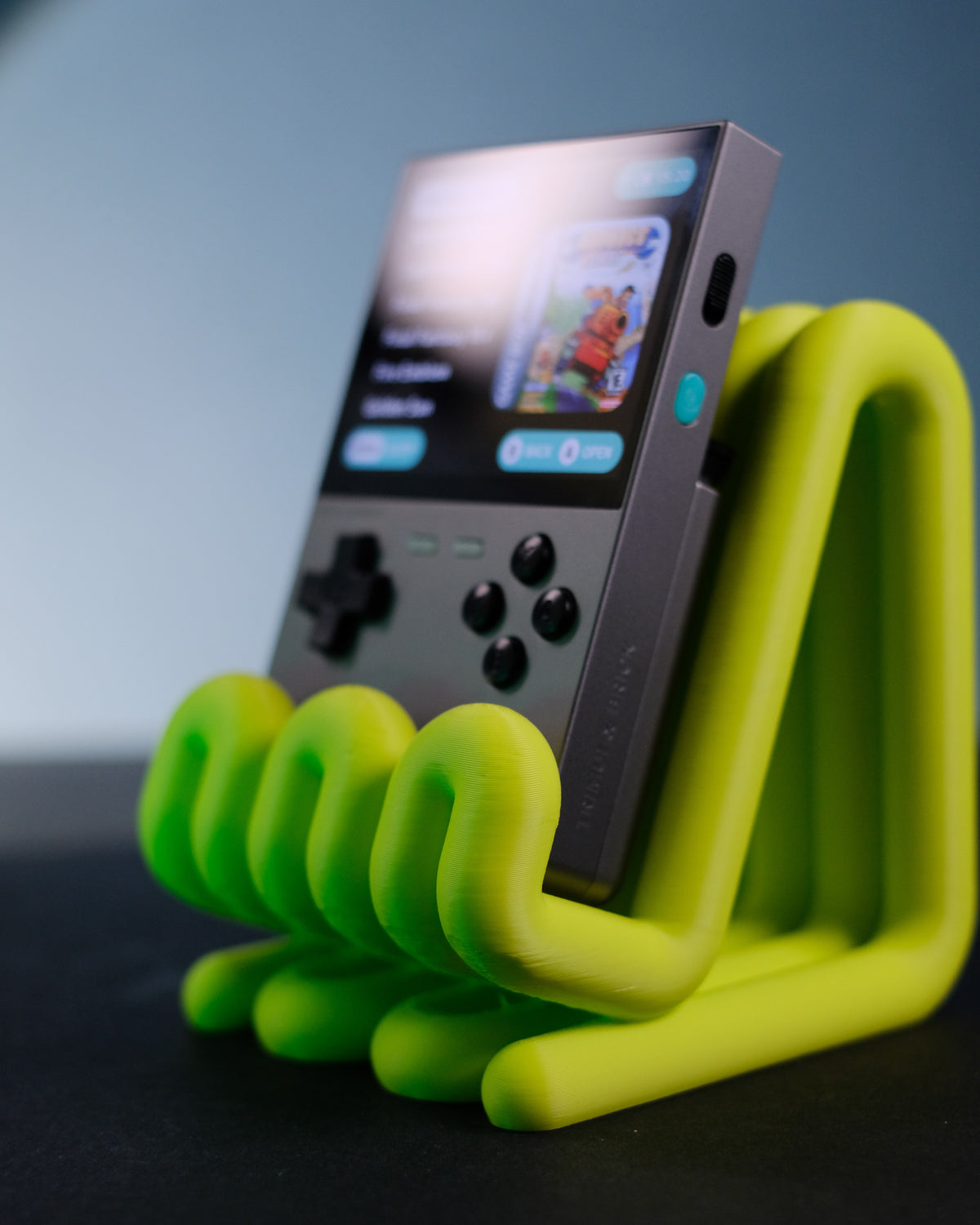 Wibble Stand with Trimui Brick held in hands lifestyle