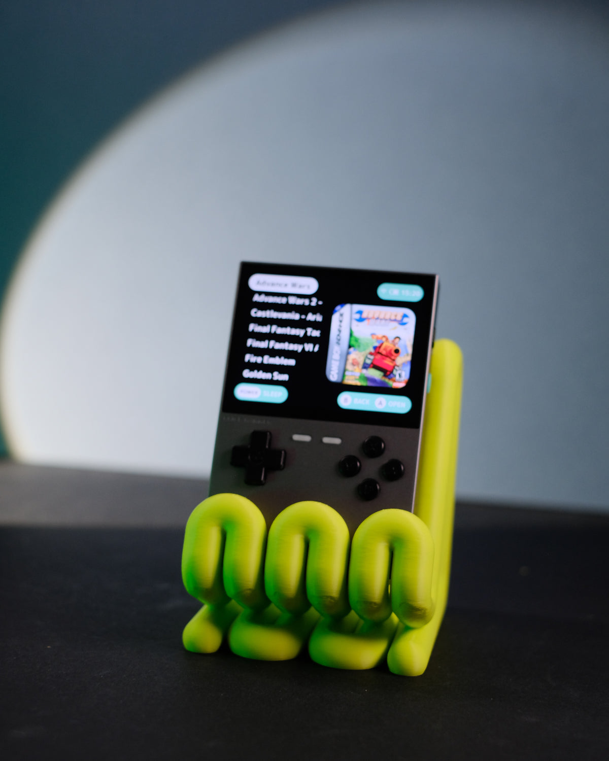 Wibble Stand with Trimui Brick on wooden desk warm light