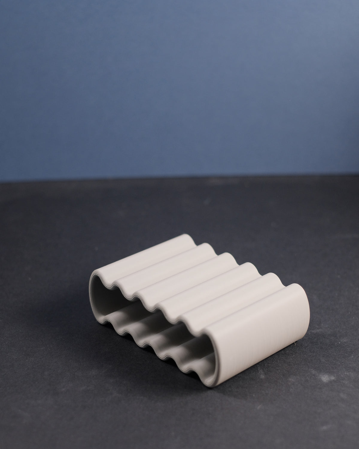 Wibble Soap Dish grey hand held product shot