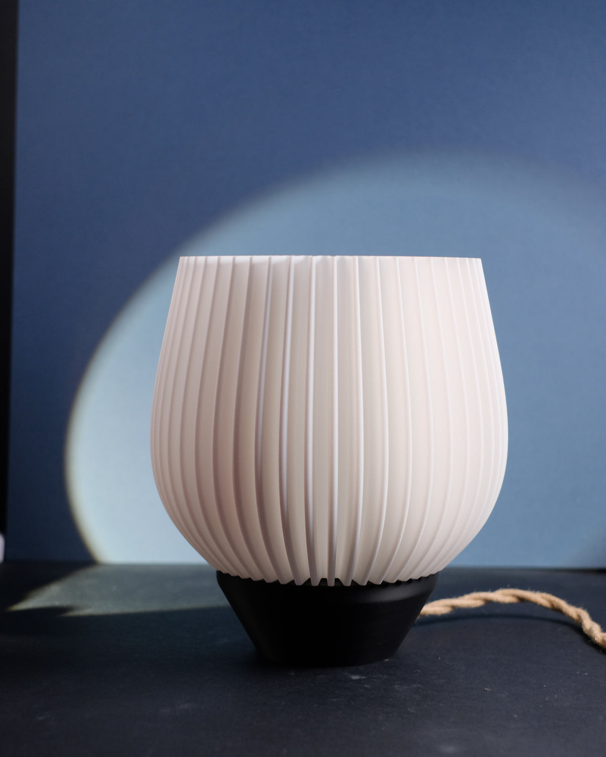 Tapered Ribbed E27 Lamp - close up on blue background