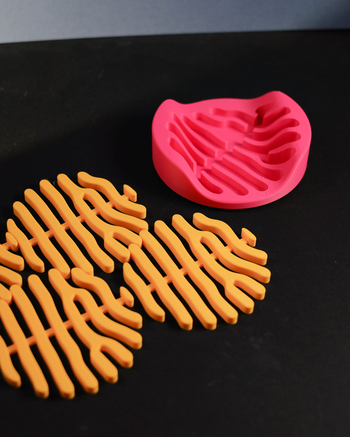 Coral coaster set on paper and eucalyptus