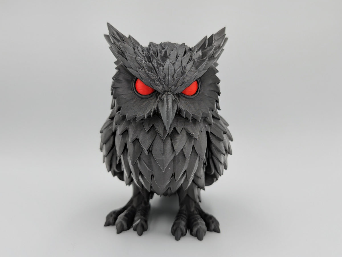 Crimson Watcher Owl front view with red eyes
