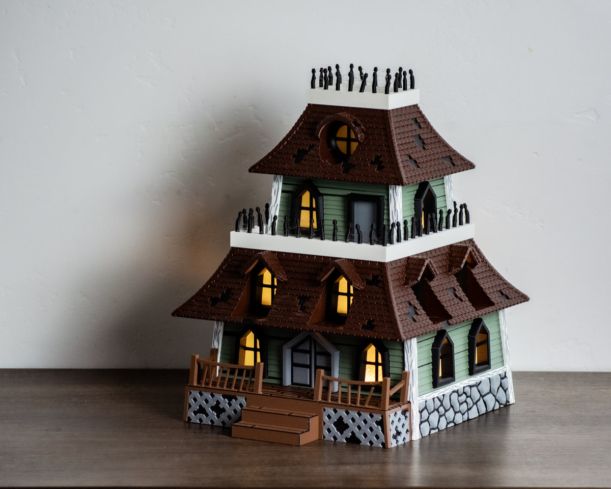 Haunted house roof and round glowing window close-up