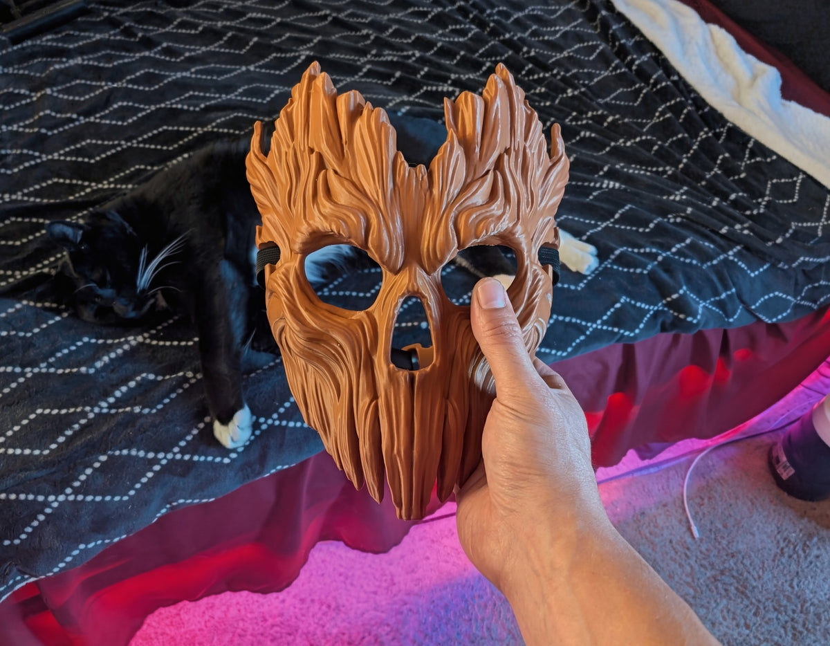 Skullbark Mask held in hand