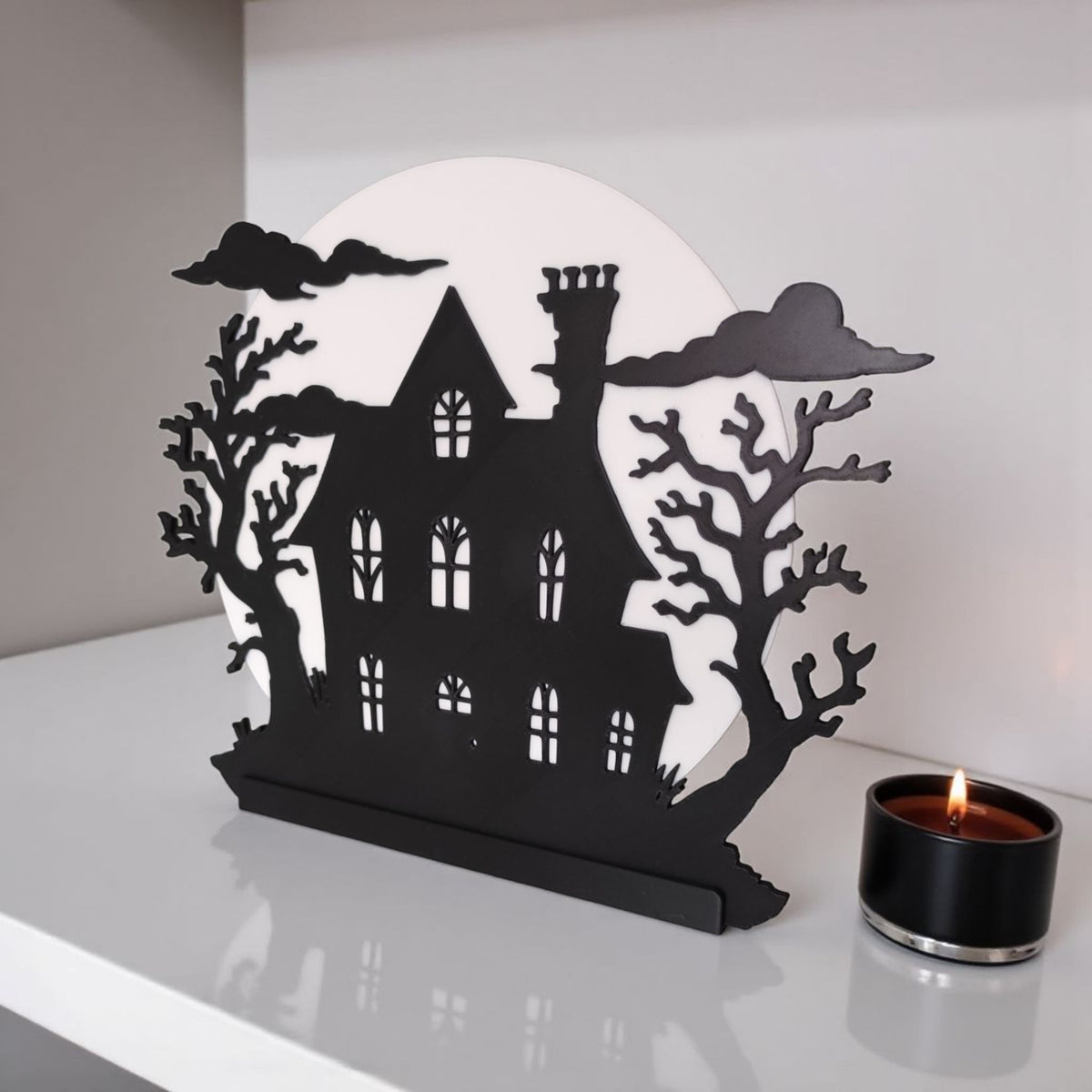 Close up of LED tealight holder stand base of haunted house decoration