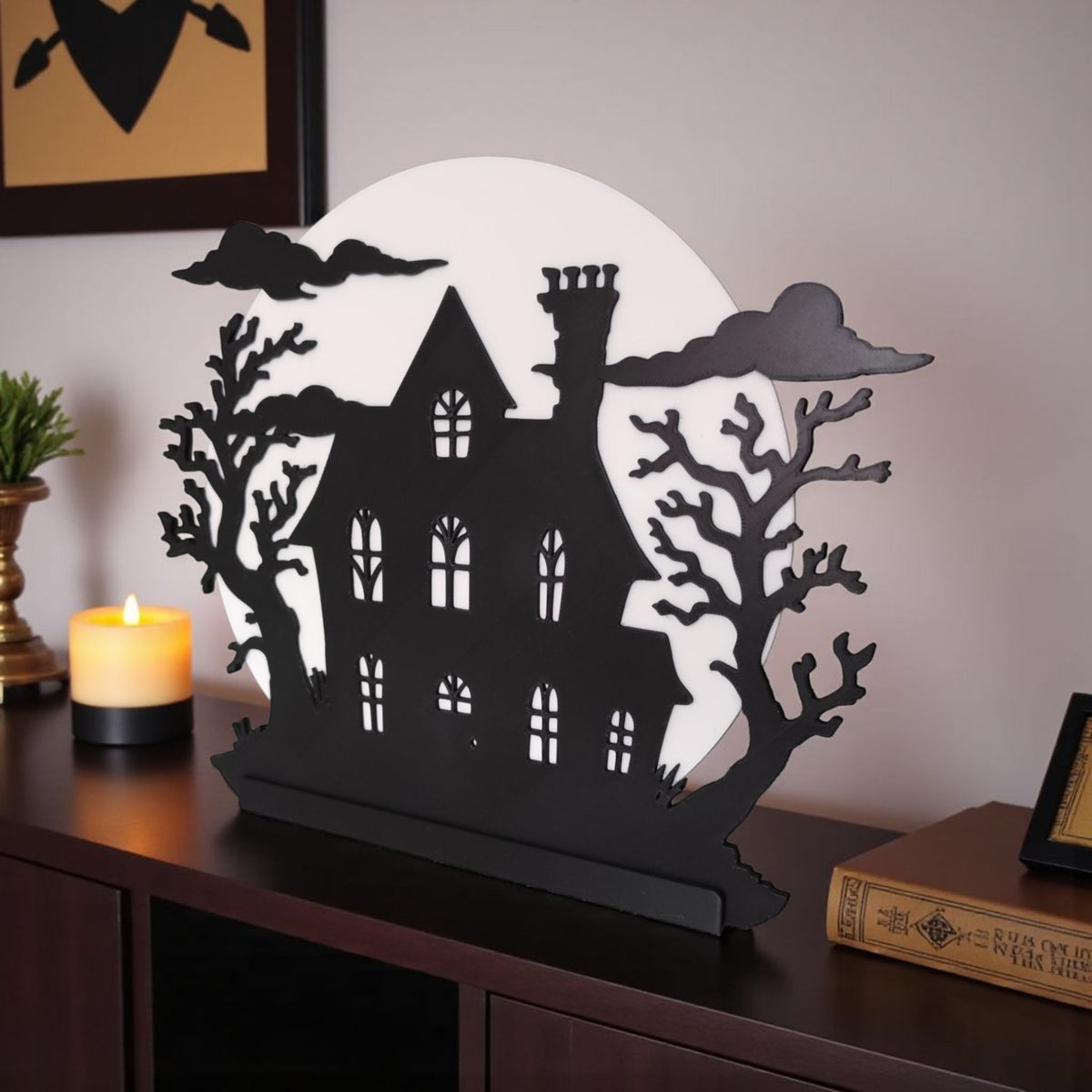 Haunted house decoration with candy corn scattered on white surface warm amber glow