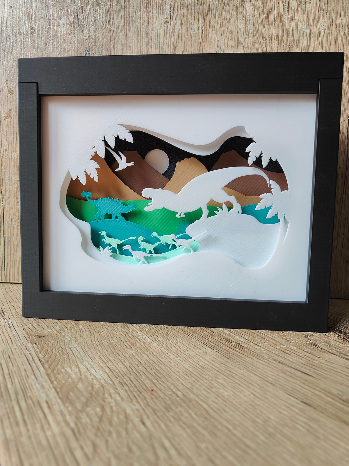 Dinosaur shadow box - full front view with Cretaceous scene on wooden surface