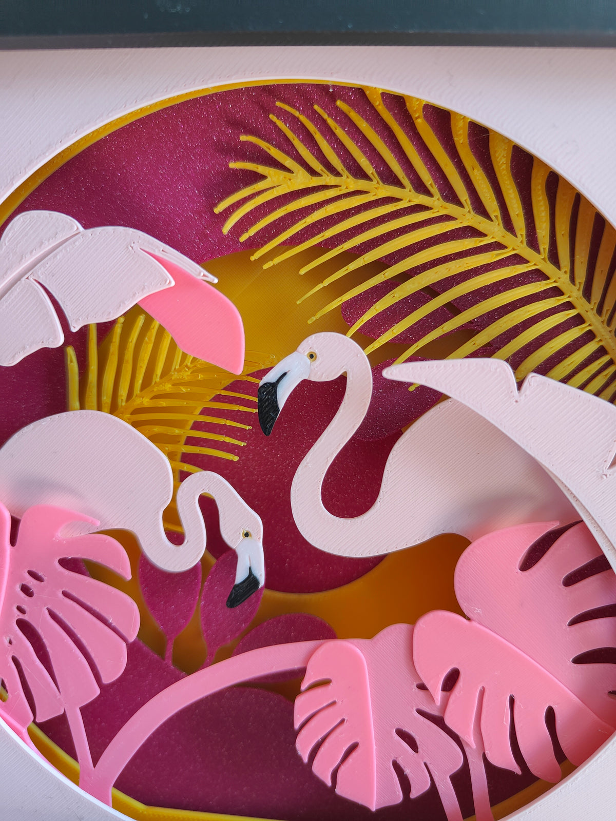 Flamingo Paradise shadow box - close up of flamingos monstera leaves and golden palm frond detail