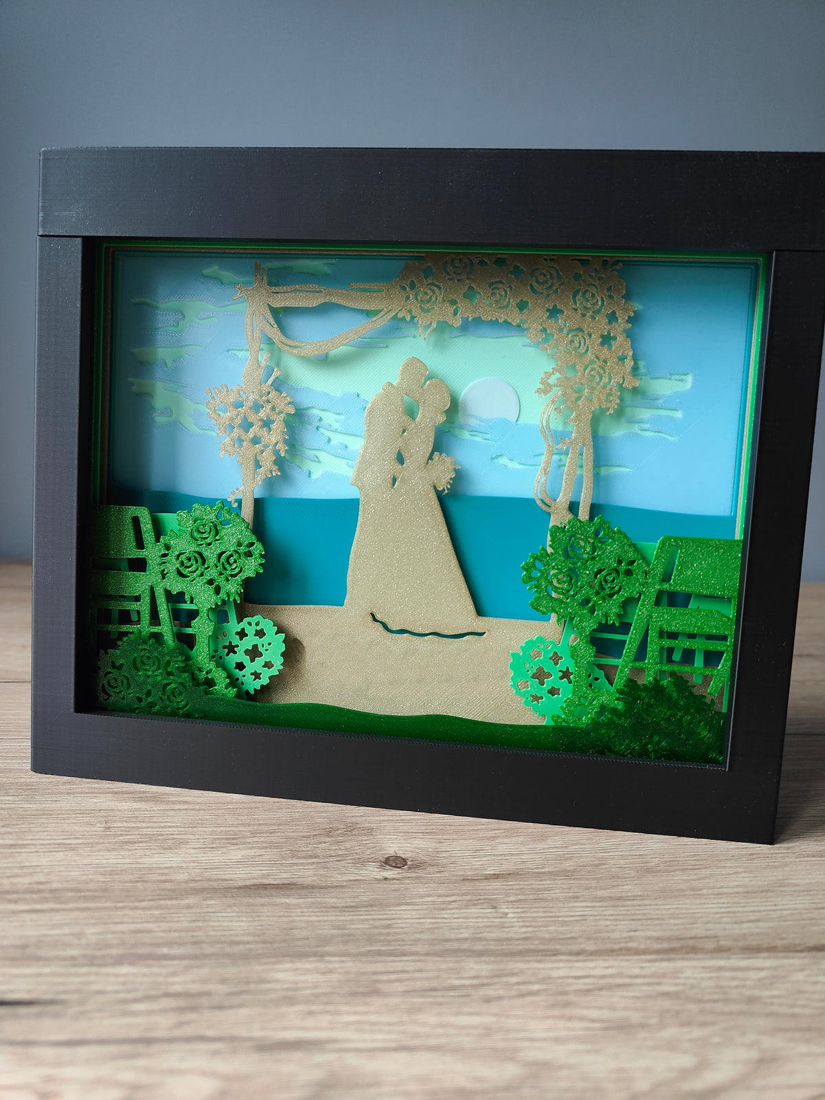 Wedding shadow box - bride and groom under floral arch front view