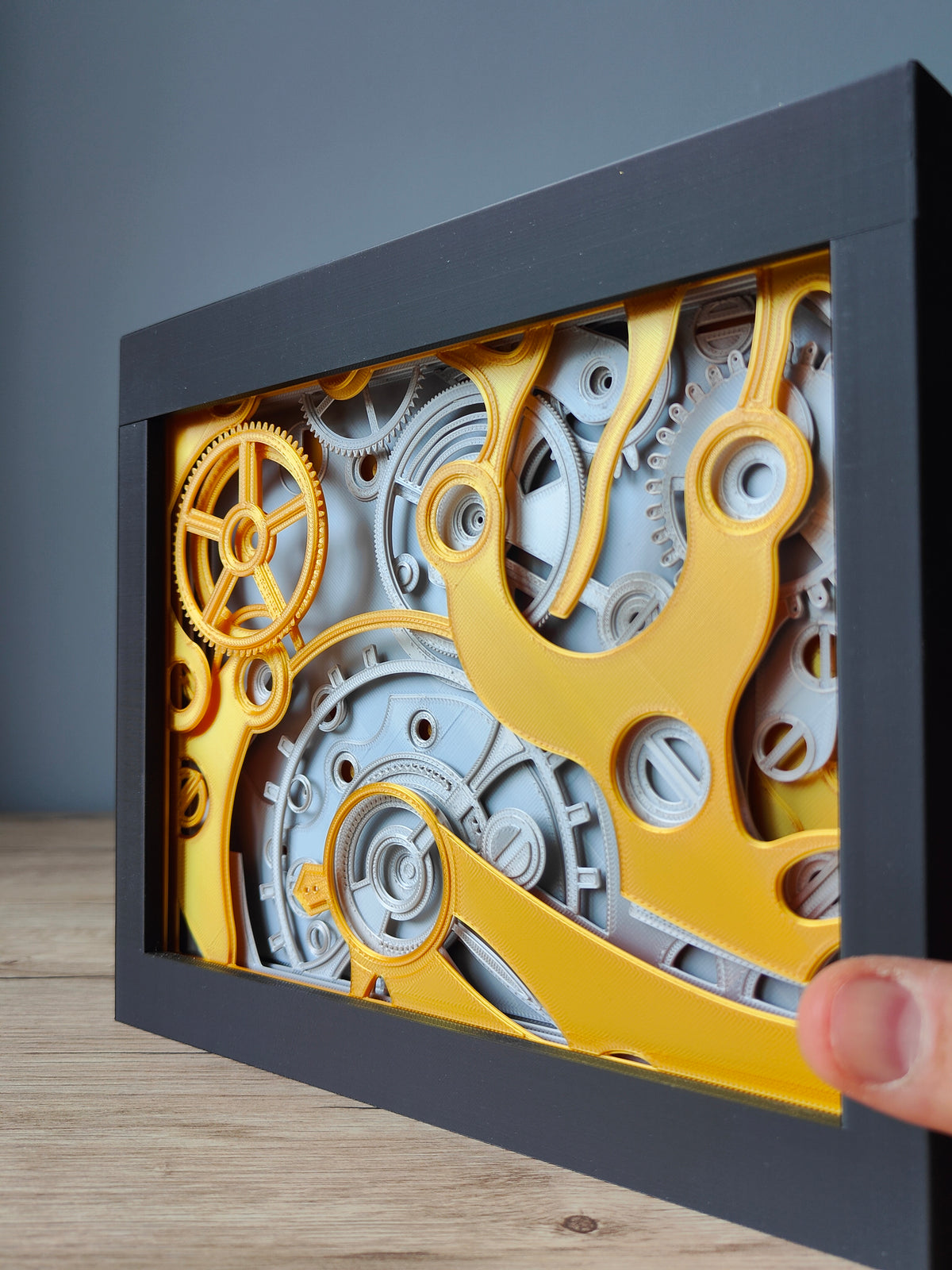 Clockwork shadow box - side angle showing extraordinary depth of multi-layer gear mechanism