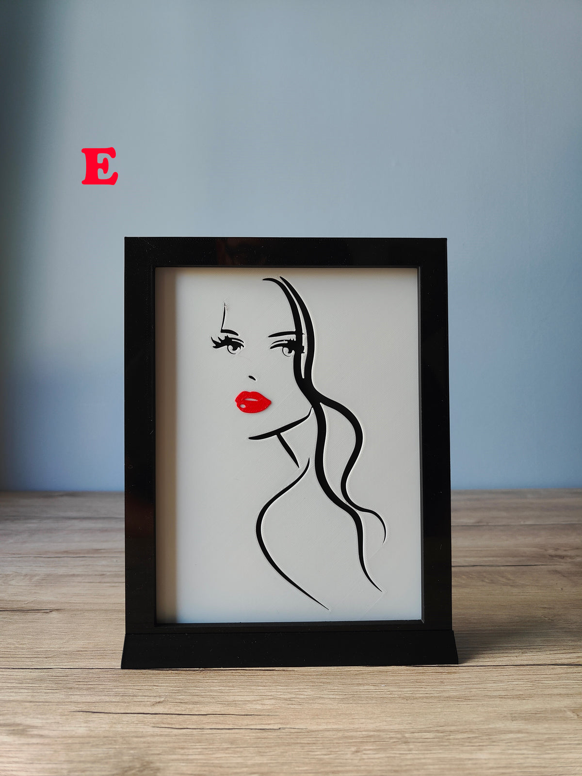 A Woman's Face Shadow Box H - dramatic flowing long hair side profile with red lips
