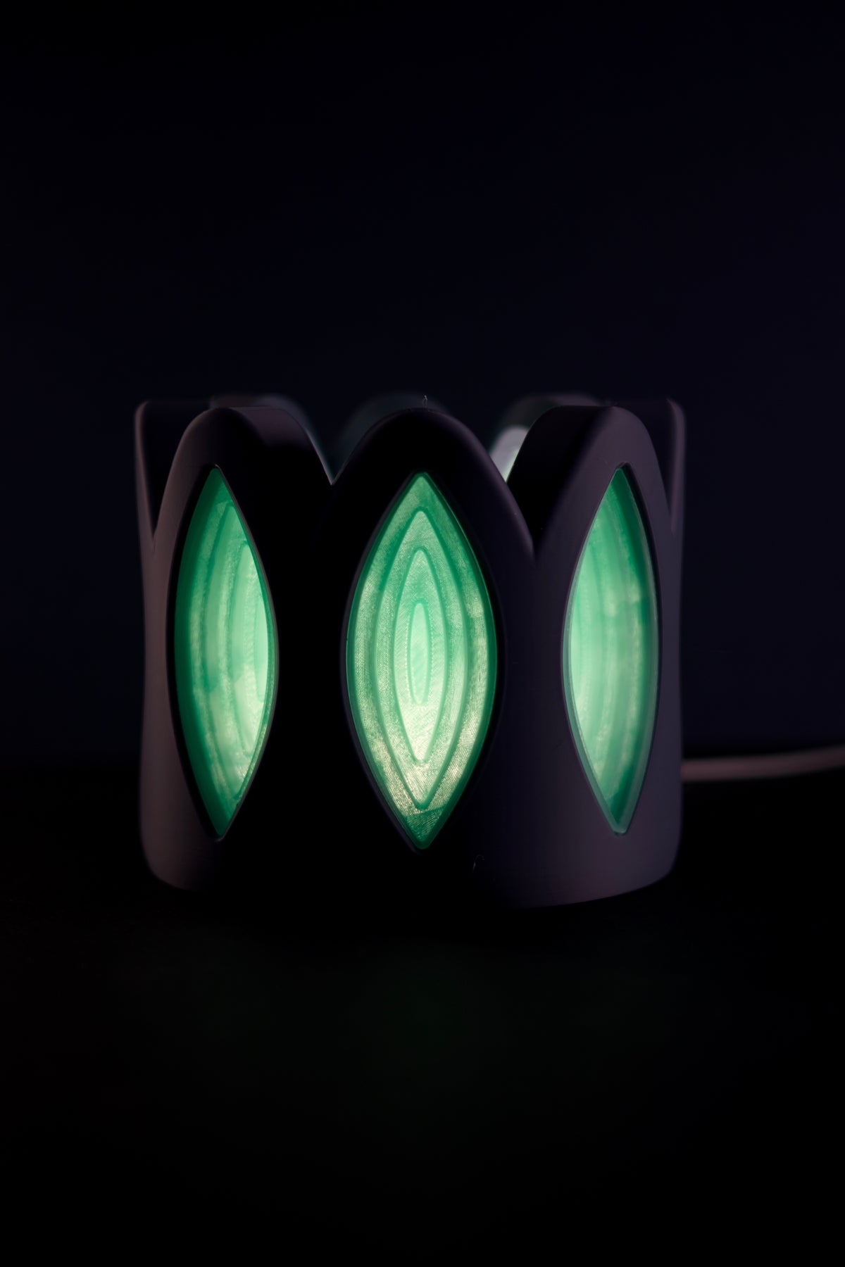 Whimsical Window Desktop Lamp top down view neon green glow petal windows dark background
