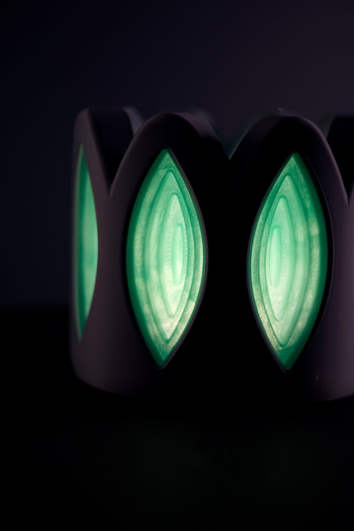 Whimsical Window Desktop Lamp wide side view neon green glow four petal windows cable dark background