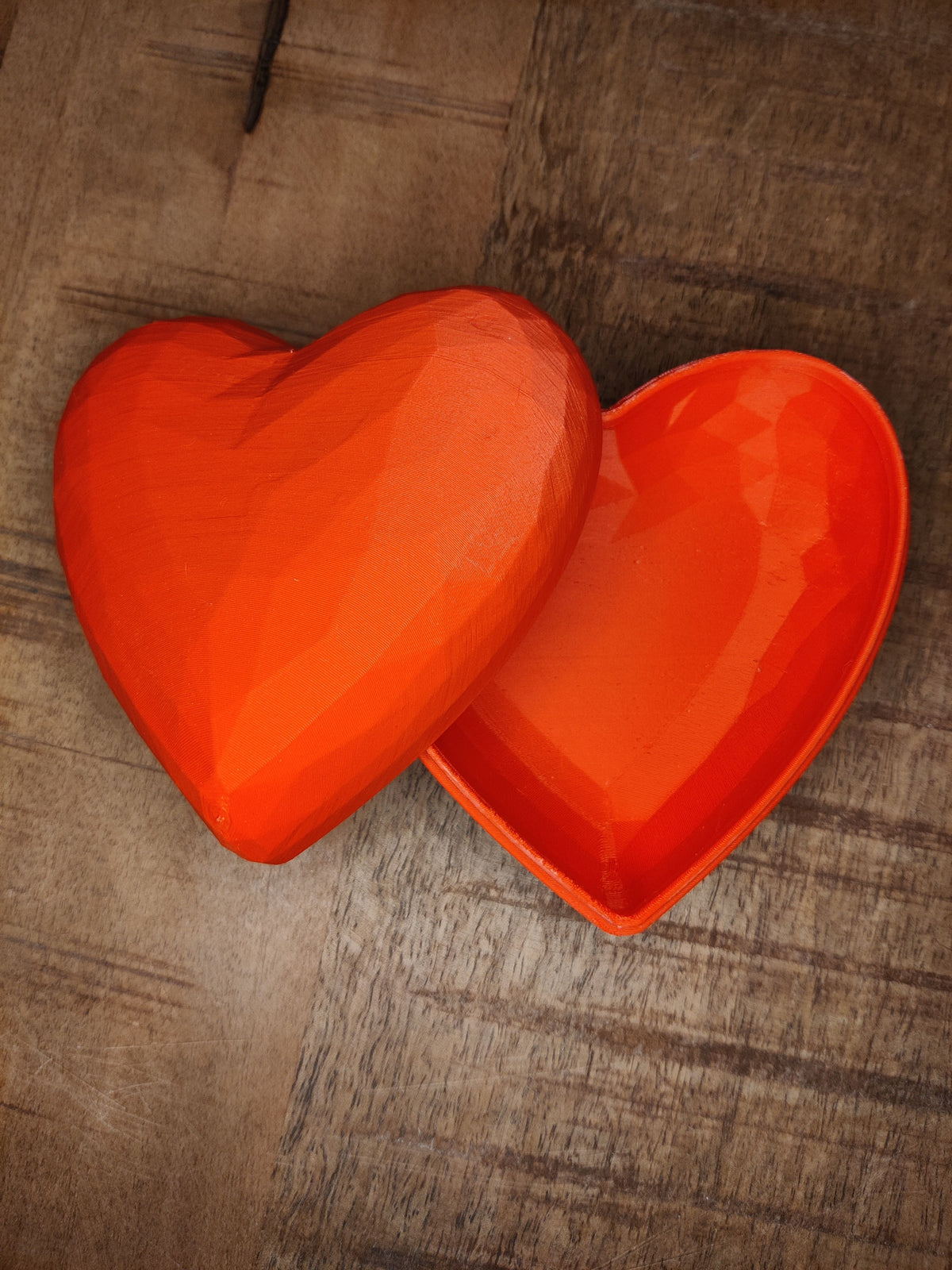 Heart-shaped gift box closed - red, front view
