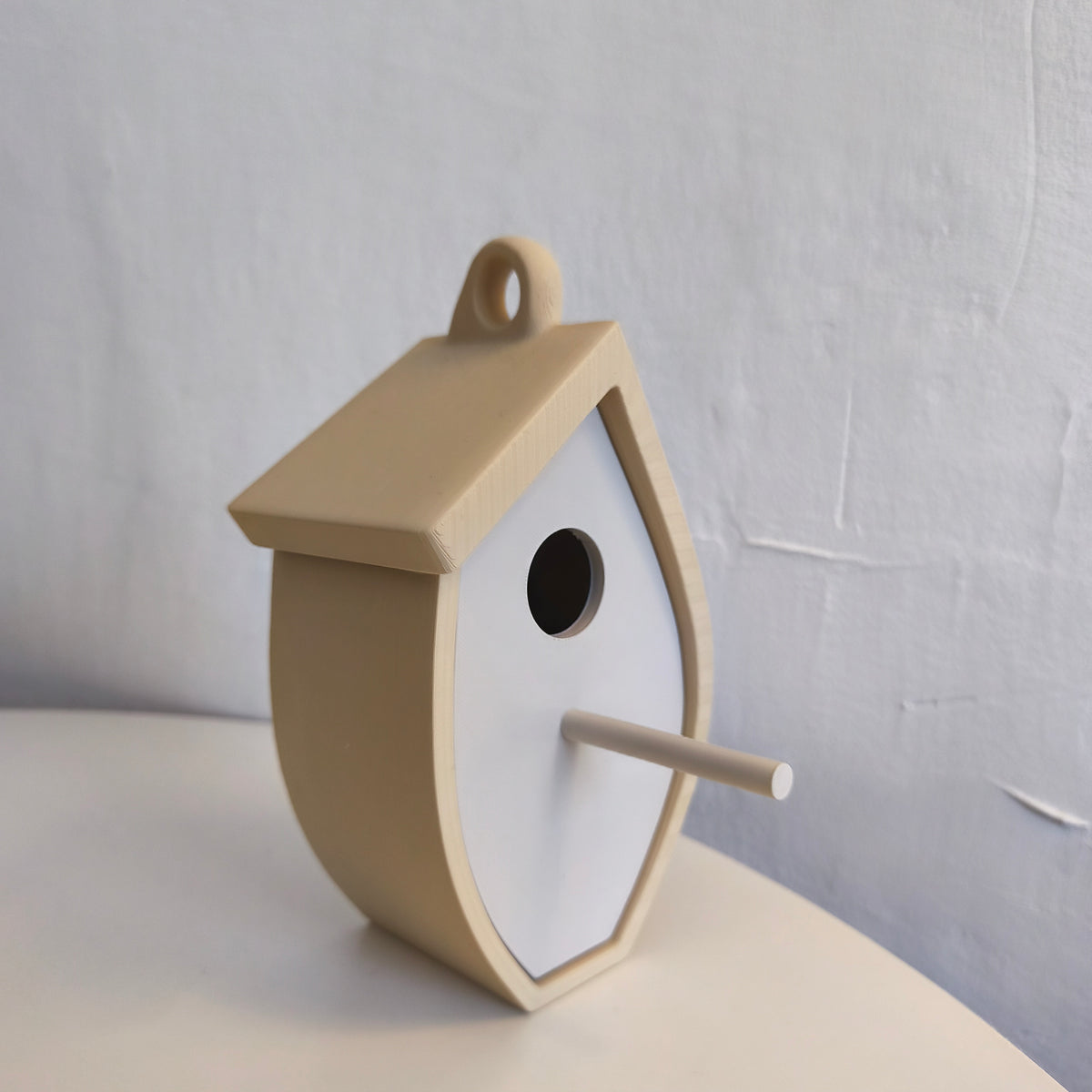 Close front detail of leaf-shaped birdhouse
