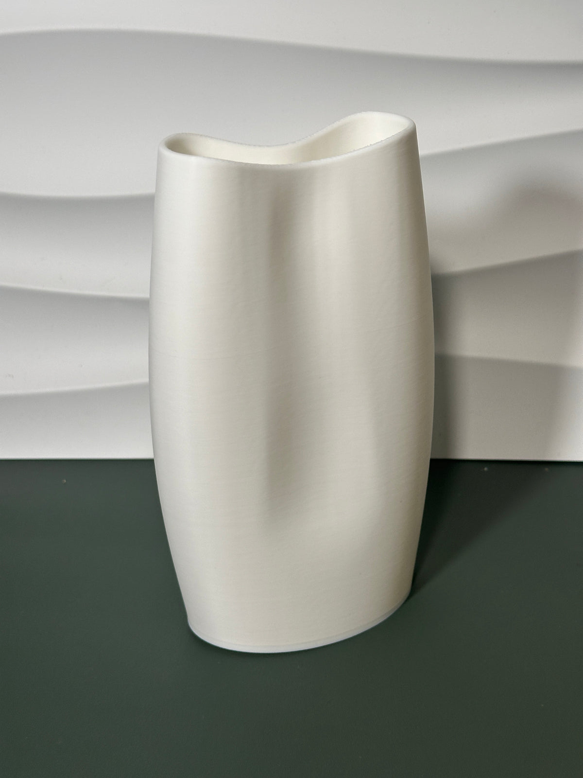 Modern Minimalist Vase real photo blush pink close up showing smooth surface texture and saddle dip rim detail warm light