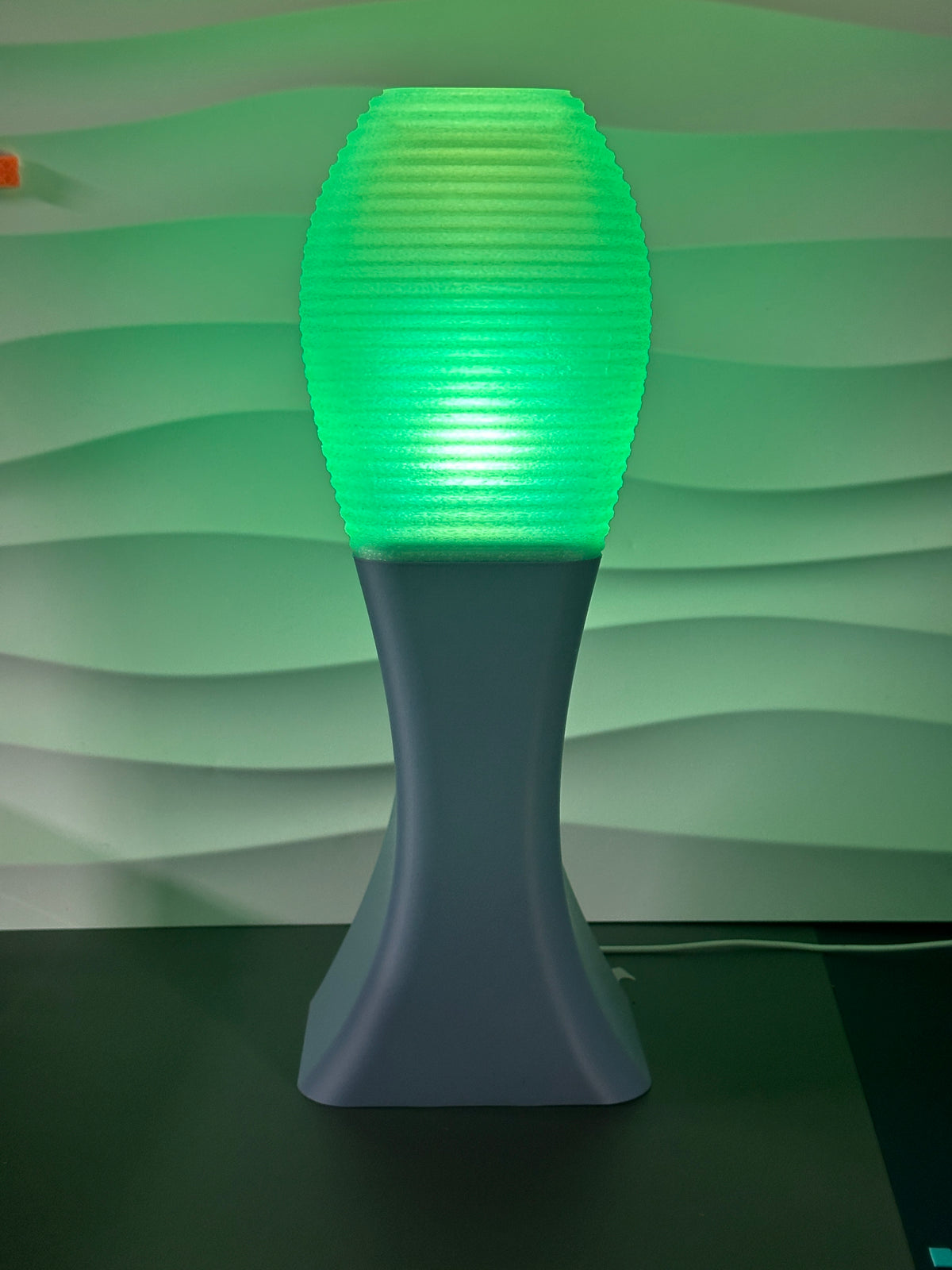 Elegant Sweeping Curve Lamp green shade held top view natural light window