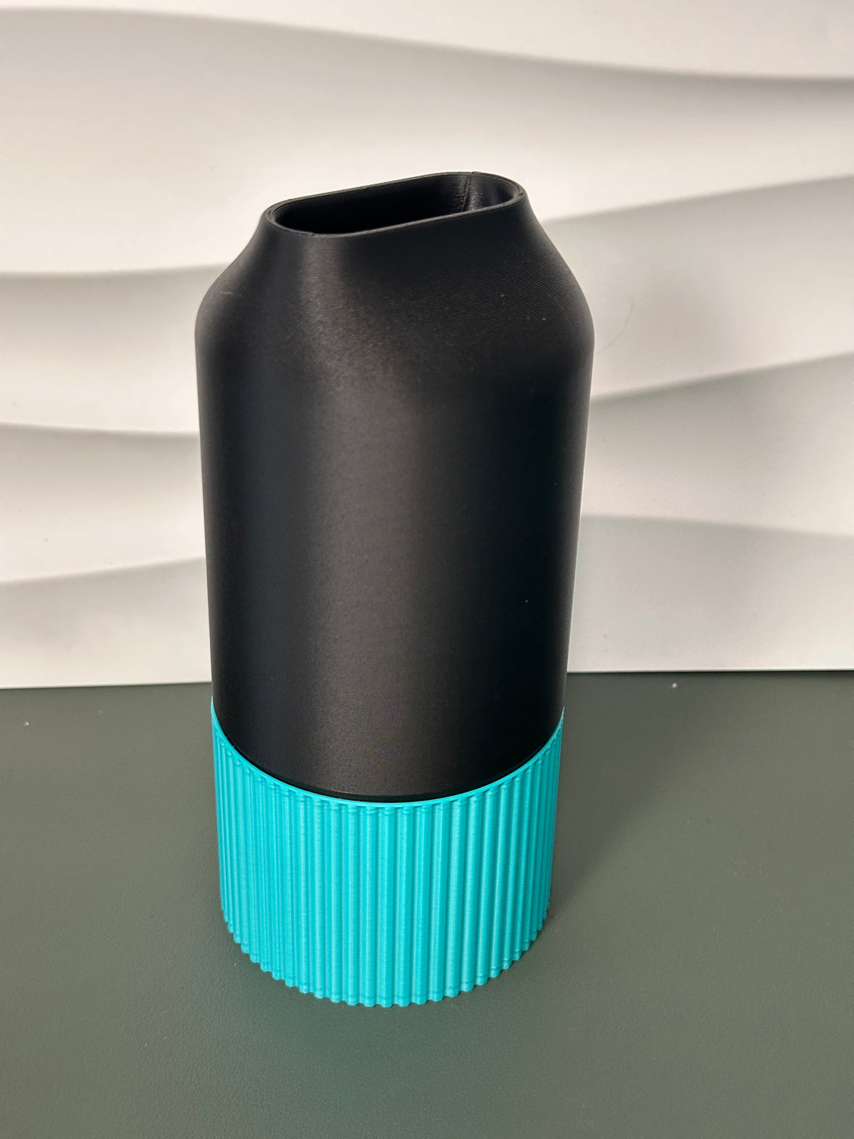 Elegant Two-Part Slot Vase black teal real product angled view from above showing slot opening