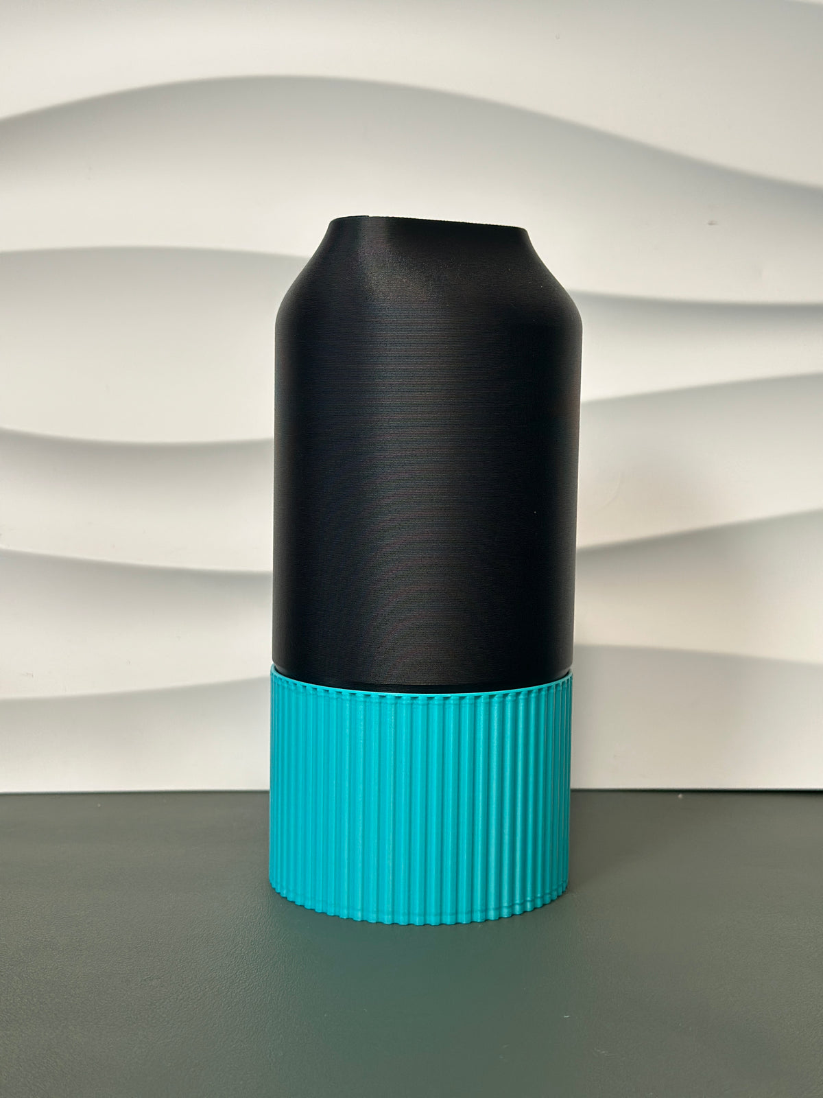 Elegant Two-Part Slot Vase black teal real product close up ribbed base detail