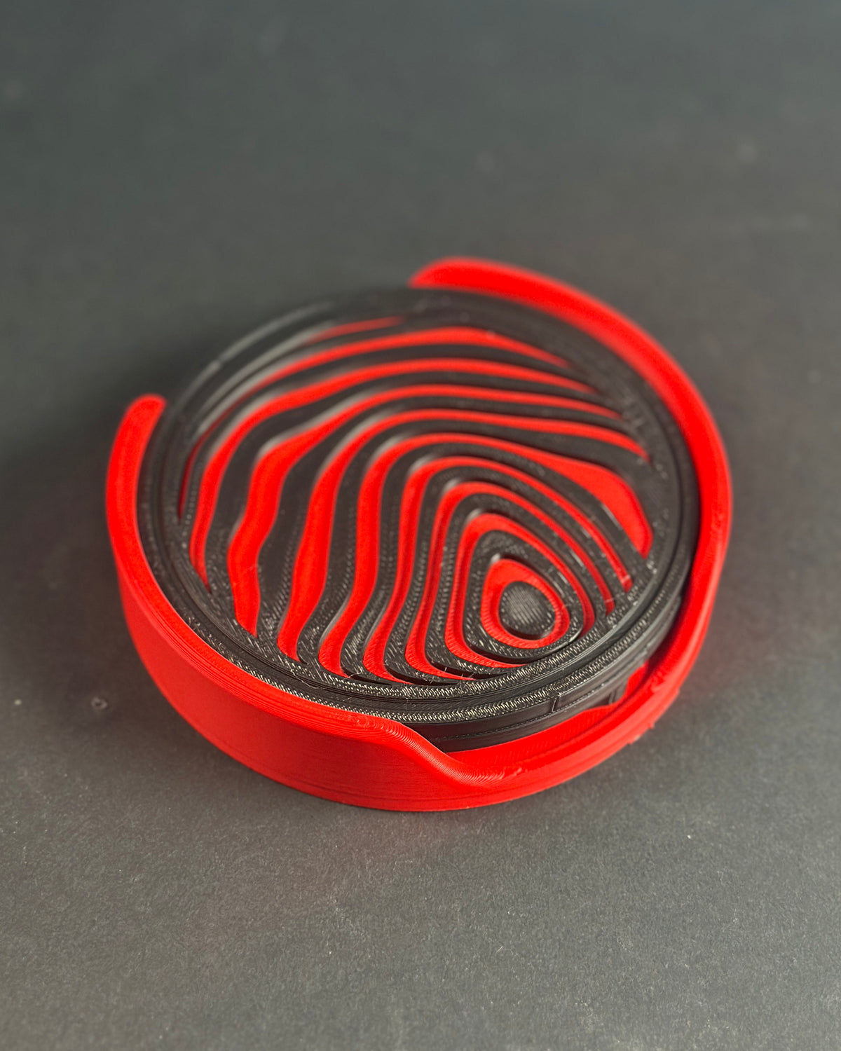 Abstract sphere coaster set held in hand